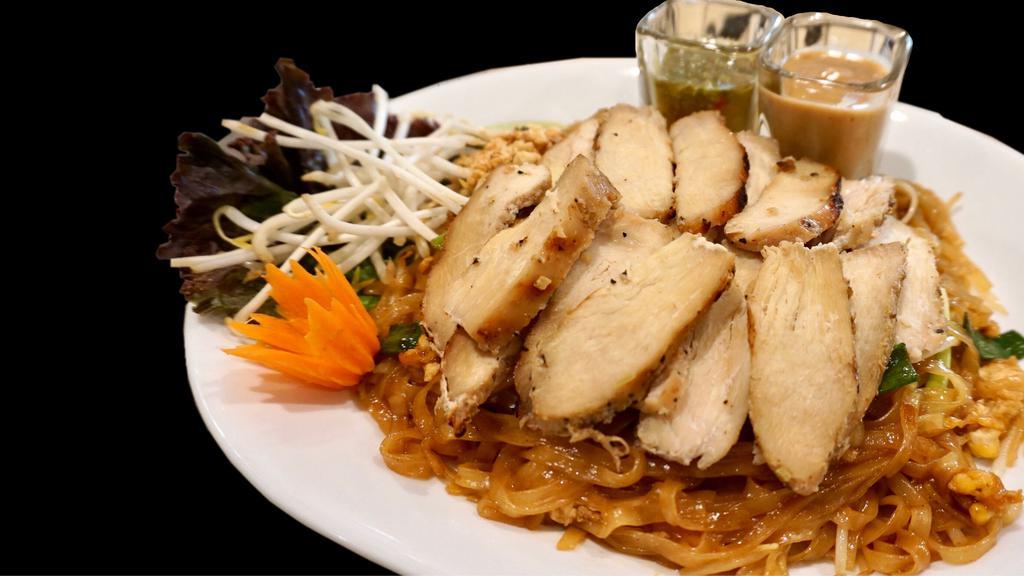 S-1 Pad Thai Lemongrass Chicken · Thin rice noodles,egg,bean sprout,onions,lime,ground peanut, topped with marinated grilled chicken breast, served with peanut sauce and Thai chili lime sauce