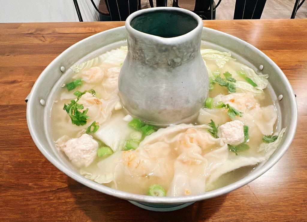 33. Shrimp Wonton Soup · Traditional Thai soup with shrimp wonton, ground chicken, green onion, cilantro and napa cabbage