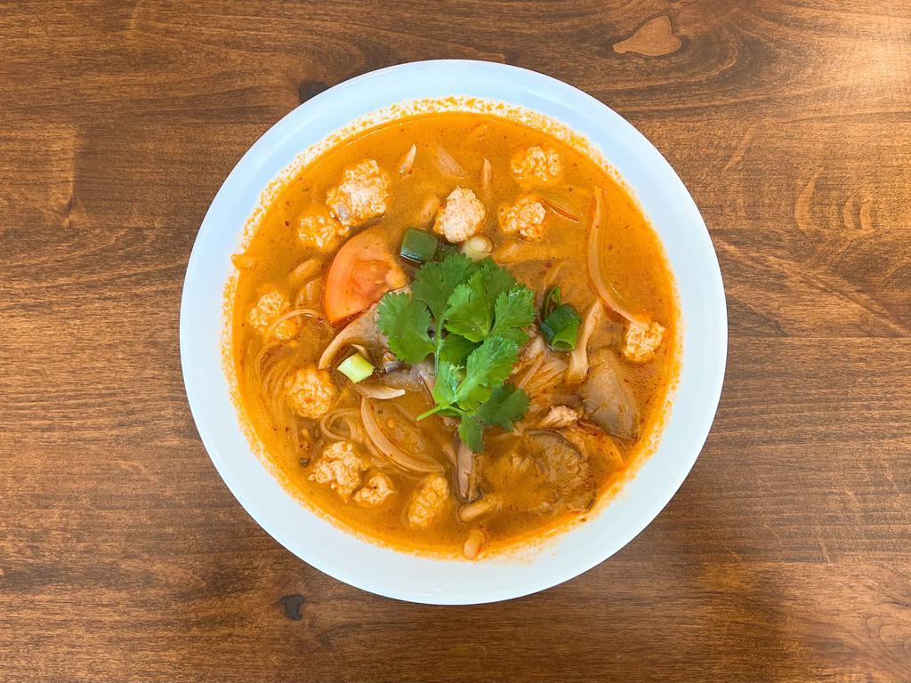 67. Tom Yum Noodle Soup · Steamed rice noodle in Tom Yum soup with ground chicken, mushroom, onion and cilantro