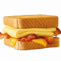 BREAKFAST TOASTER® · Behold – melty cheese, your choice of savory sausage or crispy bacon, all stacked up on thic...