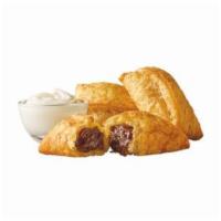 Cinnabon Cinnasnacks®  · Cinnasnaks are warm buttery pastries filled with gooey cinnamon roll fillling. Served with o...