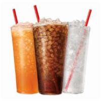 Soft Drinks + flavor add ins · More options of cold, bubbly refreshments with your choice of flavor add-ins, all served ove...