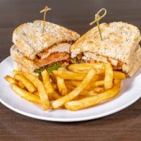 Chicken Avocado Club Sandwich · Chicken breast, avocado slices, bacon, tomato, and chipotle mayo on sourdough. Make it glute...
