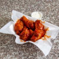 Buffalo Wings · Cooked wing of a chicken coated in hot, mild or BBQ sauce.  