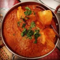 Chicken Vindaloo · Goan special chicken simmered in fiery hot sauce with potato. Served with rice.