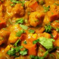 Mixed Vegetable Curry · Mixed vegetables cooked in Bombay style curry sauce. Served with rice.