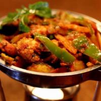 Vegetable Jalfrezi · Fresh vegetables cooked with onion, bell peppers, and tomato. Served with rice.
