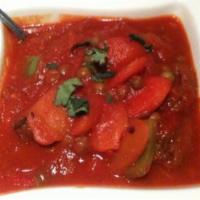 Vegetable Vindaloo · Vegetable medly cooked in fiery hot sauce. Served with rice.