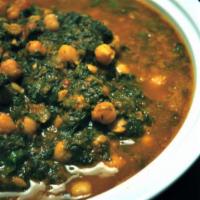 Chana Saag · Garbanzo beans with home cooked spinach and whole spices. Served with rice.