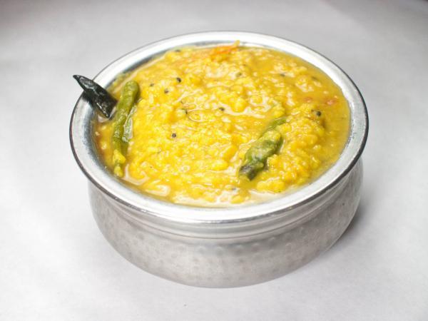 Dal Tadka · Yellow mixed lentils, cumin, and herbs. Served with rice.