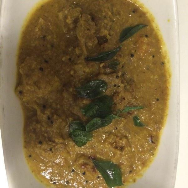 Lamb Madras · Marinated lamb tempered with mustard seeds, herbs, and coconut. Served with rice.