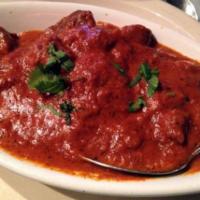 Lamb Tikka Masala · Tandoori grilled lamb cooked with creamy, velvety sauce. Served with rice.