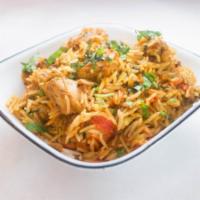 Bombay Chicken Biryani · Chicken cooked with aromatic rice and spices.