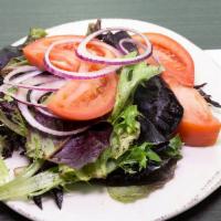 House Salad · Mixed greens with sliced red onion, diced tomatoes and drizzled with our own Goddess dressing.