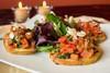 Bruschetta · Toasted French toast with shaved Parmesan cheese and fresh mix of colorful flavors with garl...