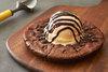 Family Pizza Brownie · A warm, fresh oven baked brownie covered with chocolate chip ice cream. A treat for the whol...