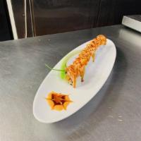 SOS ROll  · crispy tempura green onion, shrimp tempura, spicy crab meat, top with salmon, spicy mayo & e...