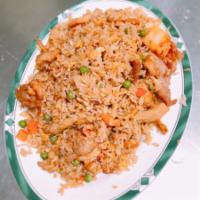 F8. Combo Fried Rice · Chicken, beef, pork and shrimp stir fried with rice. Served with peas and carrots, onions an...
