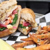 Ocean Perch Sandwich Lunch · Perch, tartar sauce, spinach, tomatoes, pickled red onions, on ciabatta bread.
