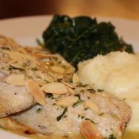 Pesce Bianco Almondine · Wood oven roasted white fish lemon butter almond sauce served with spinach and garlic mashed...