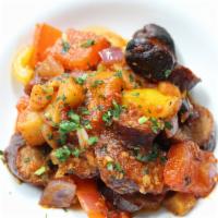 Sausage and Peppers · Italian sausage, bell peppers garlic sauce, portabella mushrooms, potatoes, and onions. Glut...