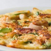 Haemul Pajeon  · Korean seafood pancakes. Prawn, squid, scallop, scallion, zucchini, onion, carrot, jalapeno ...