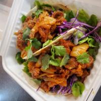 2 Pieces (large) Kimchi Bulgogi Tacos · Choice of protein, red cabbage, cilantro and homemade organic chili sauce on a large size fl...