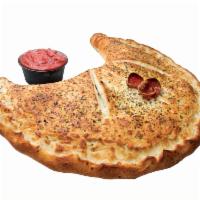 Huge Calzone · Our HUGE Calzone is stuffed with Mozzarella and filled with your choice of one free topping.