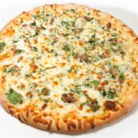 Steak in the Grass Pizza · White garlic sauce, steak, fresh spinach, and mozzarella cheese.