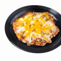 1 Piece Fiestada · Beef and cheddar appetizer pizza with a side of hot sauce.
