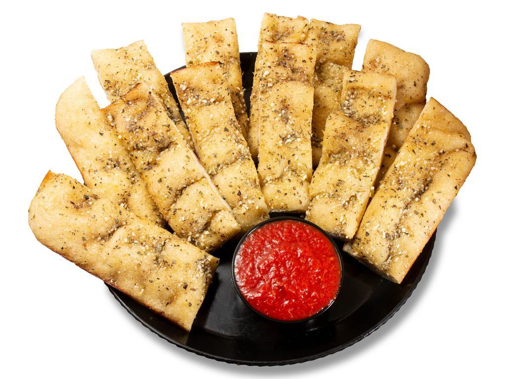 Original Yummy Bread Sticks · 12 pc Oven baked garlic buttered breadsticks topped with seasonings, and Parmesan cheese. Served with pizza sauce for dipping.