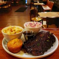 Sweet & Sticky Glazed Baby Back Ribs · Half Rack of Baby Back Pork Ribs with a Concord Grape Glaze. Comes with Coleslaw, Cornbread ...