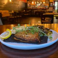 Cedar Plank Salmon · Wood Fire grilled on a cedar plank Smoked Salmon. Comes Fried Brussels plus a Choice of Side