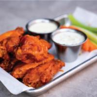 Buffalo Chicken Wings · 7 crispy chicken wings tossed in our house made buffalo sauce and served with celery, carrot...