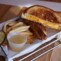 Kids Grilled Cheese · A grilled cheese sandwich with american cheese. Served with your choice of fries and applesa...