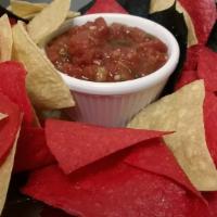 Chips and Fire Roasted Salsa · Tortilla chips served with fire roasted salsa.