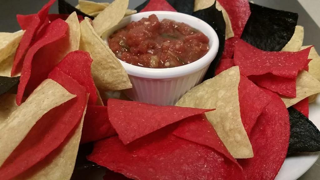 Chips and Fire Roasted Salsa · Tortilla chips served with fire roasted salsa.