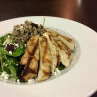 Quinoa Salad · Spinach topped with quinoa, tart dried cherries, toasted almonds and goat cheese. Tossed in ...