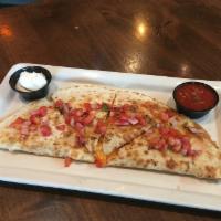 Chicken Quesadilla · Flour tortilla loaded with cheddar cheese, roasted chicken caramelized onions and peppers, s...