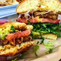 Tempeh Baga Burger · Organic tempeh, caramelized onion, provolone melt, garlic jam, avocado, romaine, tomato and ...