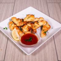 Garlic Knots · Homemade pizza dough topped with extra virgin olive oil, garlic, and romano cheese. Served w...