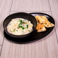 Spinach and Artichoke Dip · A blend of fresh spinach, kale, artichoke hearts and roasted garlic, swirled in creamy Alfre...