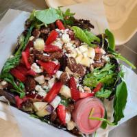 Apple Pecan Salad · Mixed greens tossed with apples, candied pecans, and house made raspberry vinaigrette. Toppe...