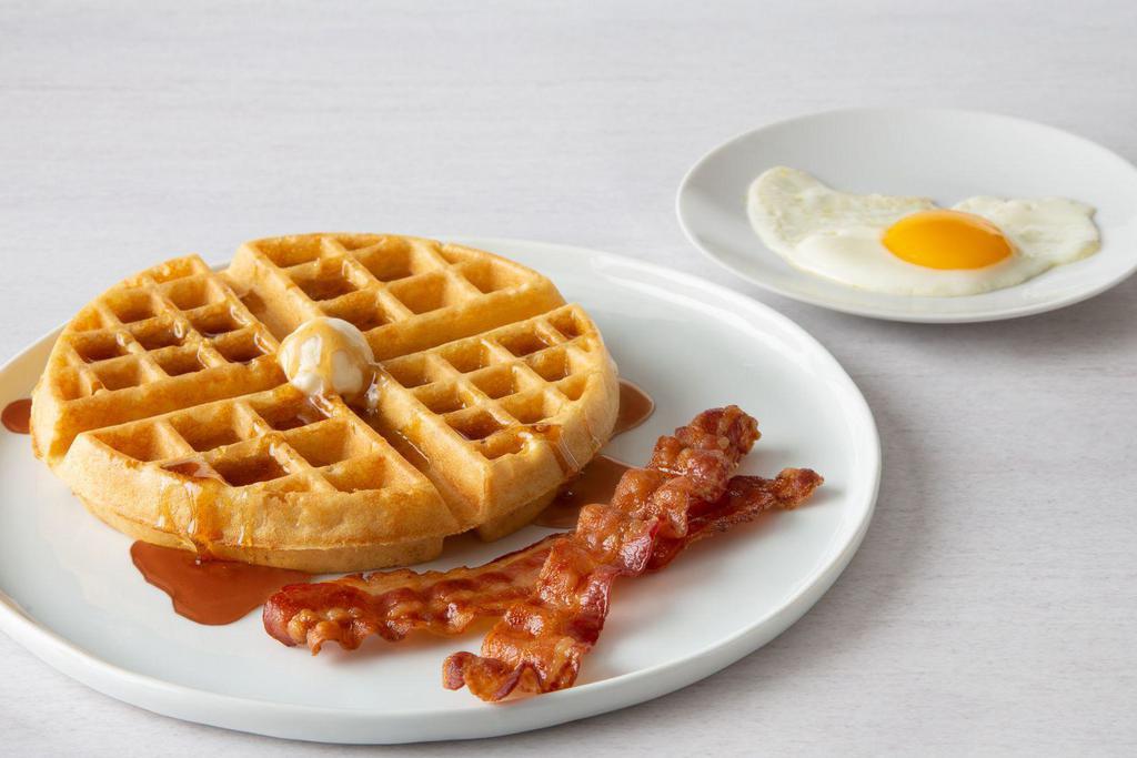 Belgian Waffle Combo · One egg, any style and Belgian waffle served with two cherrywood-smoked bacon strips or two sausage links.