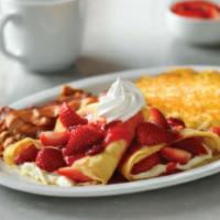 Strawberry Crepes Combo · 2 strawberry and cream crepes, with hash brown and 2 cherrywood smoked bacon strips or 2 sau...