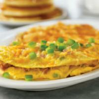 Denver Omelette · A trio of ham, fresh green peppers and onions, topped with melted cheese and more green pepp...