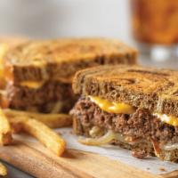 Patty Melt · A melted masterpiece. Sauteed onions, American and Swiss cheeses on grilled marbled rye bread.