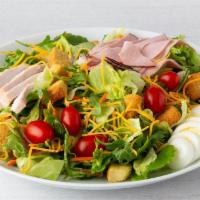 Celebrity Chef Salad · Hand-carved turkey breast, ham, cheddar cheese, tomato, hard-boiled egg, and seasoned crouto...