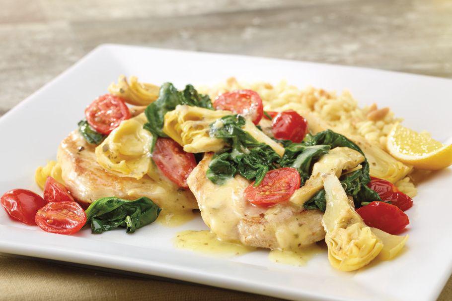 Lemon Artichoke Chicken · Grilled chicken breast with artichokes, sauteed spinach, tomatoes, and lemon butter sauce.  Served with choice of two sides.