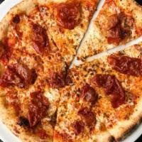 Crispy Prosciutto Pizza · San Marzano sauce, tomato, Goat cheese, housemade spicy oil, mozzarella, and crispy San Dani...
